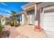 Attractive front exterior with well-maintained landscaping, double door entry and two-car garage at 1126 Winter Storm Dr, Henderson, NV 89052