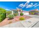 Beautiful single-story home featuring desert landscaping, tiled roof, and two-car garage at 1126 Winter Storm Dr, Henderson, NV 89052