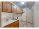 Functional laundry room featuring storage cabinets and a sink at 1126 Winter Storm Dr, Henderson, NV 89052