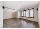 Open living room with wood-look flooring and ample light at 1126 Winter Storm Dr, Henderson, NV 89052