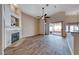 Spacious living room with fireplace, modern flooring, and backyard access at 1126 Winter Storm Dr, Henderson, NV 89052