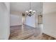 Spacious room with wood-look floors, recessed lights, decorative light fixture, and archway at 1126 Winter Storm Dr, Henderson, NV 89052