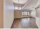 Inviting living room featuring vaulted ceilings, wood-look flooring, and bright window views at 1126 Winter Storm Dr, Henderson, NV 89052
