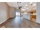 Bright open living room with modern flooring, backyard access, and kitchen access at 1126 Winter Storm Dr, Henderson, NV 89052
