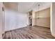 Spacious living room with wood-look flooring, neutral color palette, and decorative chandelier at 1126 Winter Storm Dr, Henderson, NV 89052