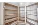 Walk in pantry with wooden-slatted shelving providing ample storage space at 1126 Winter Storm Dr, Henderson, NV 89052