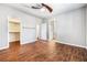 Spacious bedroom with wood-look flooring and access to en suite bathroom at 11375 Ogden Mills Dr # 103, Las Vegas, NV 89135