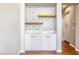 Dining area features stylish tiled accent wall and wooden shelves at 11375 Ogden Mills Dr # 103, Las Vegas, NV 89135