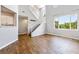 Spacious living area with hardwood floors and natural light beaming through the windows at 11375 Ogden Mills Dr # 103, Las Vegas, NV 89135
