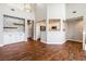 Open floor plan with tile backsplash, high ceilings, hardwood floors, and lots of natural light at 11375 Ogden Mills Dr # 103, Las Vegas, NV 89135