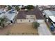 Aerial view of home with desert landscaping, driveway and updated roof at 120 Dogwood St, Henderson, NV 89015