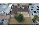Aerial view of a home with a gravel yard and concrete patio and a tree in the backyard at 120 Dogwood St, Henderson, NV 89015