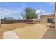 Large backyard with desert landscaping, patio, block fence and mature tree at 120 Dogwood St, Henderson, NV 89015