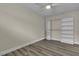 Bedroom with spacious closet, hardwood floors, and modern ceiling fan for comfort at 120 Dogwood St, Henderson, NV 89015