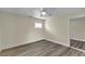 Bright bedroom features wood-look floors, ceiling fan, and closet for ample storage at 120 Dogwood St, Henderson, NV 89015
