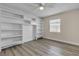 Bedroom with custom built-in shelving, modern floors and neutral color scheme at 120 Dogwood St, Henderson, NV 89015