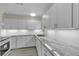 New kitchen with quartz countertops, modern white cabinets, and recessed lighting at 120 Dogwood St, Henderson, NV 89015