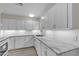 Kitchen with granite countertops, white cabinets, and stainless steel appliances at 120 Dogwood St, Henderson, NV 89015
