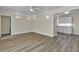 Open-concept living room with modern flooring, recessed lights and a view to the kitchen at 120 Dogwood St, Henderson, NV 89015