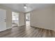 Living room showcasing new hardwood floors and an open layout to kitchen, creating a spacious feel at 120 Dogwood St, Henderson, NV 89015