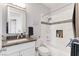 Bright bathroom featuring a tub/shower with mosaic tile accents and granite countertops at 1204 Moselle Ct, Las Vegas, NV 89144
