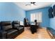 Comfortable bedroom features a wall-mounted TV and hardwood floors at 1204 Moselle Ct, Las Vegas, NV 89144