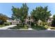 Charming two-story stucco home featuring desert landscaping, arched entry, and a two-car garage at 1204 Moselle Ct, Las Vegas, NV 89144