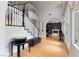 Inviting foyer features a grand staircase and views into the living spaces at 1204 Moselle Ct, Las Vegas, NV 89144