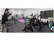 This fully equipped home gym includes various machines, weights, and space for a yoga mat at 1204 Moselle Ct, Las Vegas, NV 89144