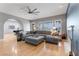 Large open living room with modern ceiling fan and wood floors is great for entertaining at 1204 Moselle Ct, Las Vegas, NV 89144
