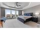 Spacious main bedroom with trey ceiling, neutral walls, carpet, balcony and plenty of natural light at 1204 Moselle Ct, Las Vegas, NV 89144