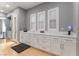 Bright room features custom cabinetry, countertops, windows with shutters and wood flooring at 1204 Moselle Ct, Las Vegas, NV 89144