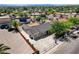 Charming single-story home with a spacious parking area, fenced yard, and mature trees in a vibrant neighborhood setting at 125 S 15Th St, Las Vegas, NV 89101