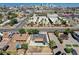 Aerial view showcasing a home, surrounding neighborhood, and city skyline in the distance at 125 S 15Th St, Las Vegas, NV 89101