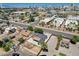 Aerial perspective of a home, neighborhood streets, and buildings with a clear view of the city skyline at 125 S 15Th St, Las Vegas, NV 89101