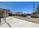 Spacious backyard featuring a concrete patio, block wall, and potential for landscaping at 125 S 15Th St, Las Vegas, NV 89101