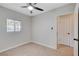 Bedroom showcasing tile flooring, a ceiling fan, and a window letting in plenty of sunlight at 125 S 15Th St, Las Vegas, NV 89101