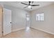 Bedroom features tile flooring, a ceiling fan, and a window with bright natural light at 125 S 15Th St, Las Vegas, NV 89101