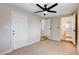 Bedroom with beige floor tiles and a ceiling fan at 125 S 15Th St, Las Vegas, NV 89101
