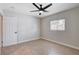 Well-lit bedroom with tile flooring, ceiling fan and a bright window at 125 S 15Th St, Las Vegas, NV 89101