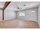 Bright living room with tile floors, beamed ceiling and a ceiling fan for added comfort at 125 S 15Th St, Las Vegas, NV 89101