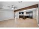 The living room seamlessly connects to an open kitchen, featuring recessed lighting, tile floors, and a ceiling fan at 125 S 15Th St, Las Vegas, NV 89101