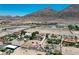Aerial view with ample land, desert landscape, and a distant mountain range in the background at 1345 Morning Sun Way, Las Vegas, NV 89110