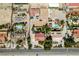 Aerial home view that shows desert landscape, mature trees and an inground pool in backyard at 1345 Morning Sun Way, Las Vegas, NV 89110