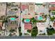 Aerial view of backyard pool, outdoor living spaces, and neighboring properties in a residential area at 1345 Morning Sun Way, Las Vegas, NV 89110