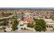Well-maintained property with lush greenery, long driveway, and ample parking space at 1345 Morning Sun Way, Las Vegas, NV 89110