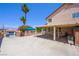 Spacious backyard featuring a covered patio area, desert landscaping and ample parking at 1345 Morning Sun Way, Las Vegas, NV 89110
