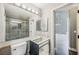 Bathroom with a large mirror, toilet, and an incomplete vanity, for remodeling at 1345 Morning Sun Way, Las Vegas, NV 89110