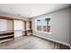 Bedroom with wood floors, custom shelving, and cityscape views at 1345 Morning Sun Way, Las Vegas, NV 89110