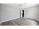 Bedroom features hardwood floors, a ceiling fan, and ample closet space for storage at 1345 Morning Sun Way, Las Vegas, NV 89110